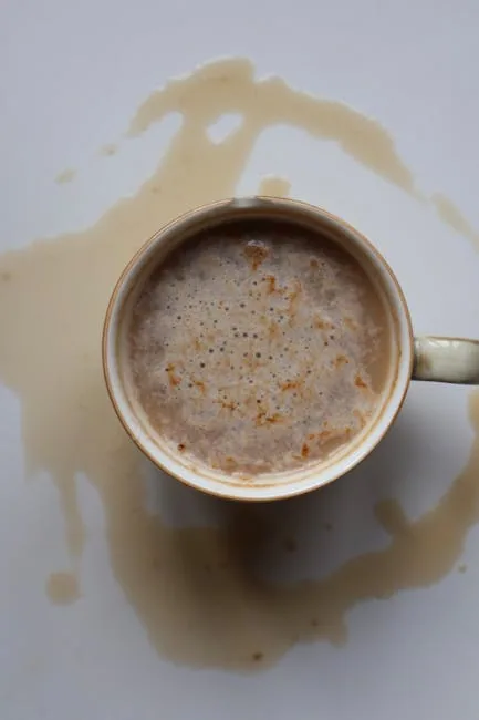 Person Removing Coffee Stain From Car Seat