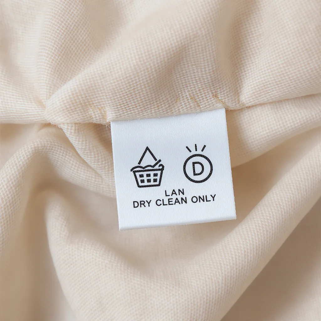 A Clothing Care Label With Machine Wash And Dry Clean