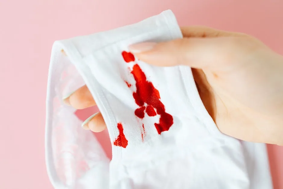 Person Removing A Foundation Stain From Shirt Collar