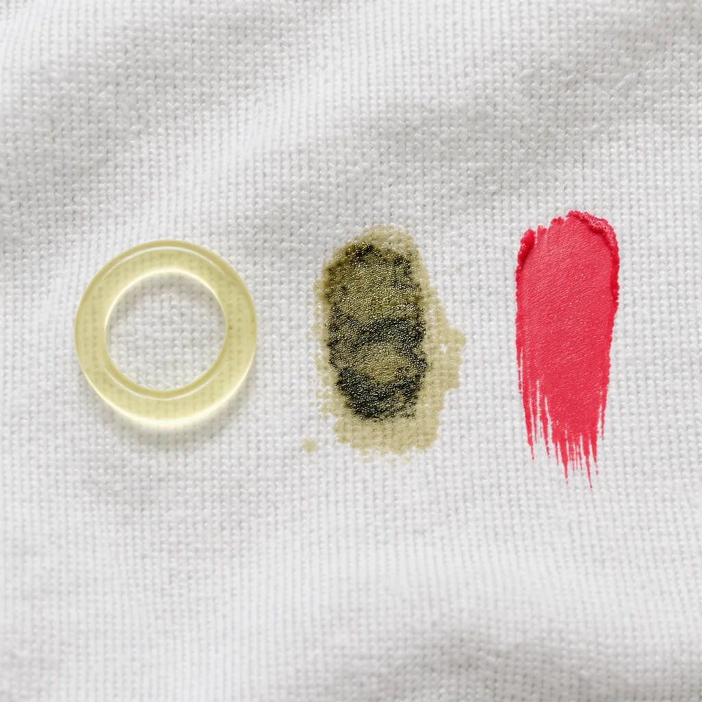 Close-up Comparison Of An Oil Ring Grease Smudge And Lipstick