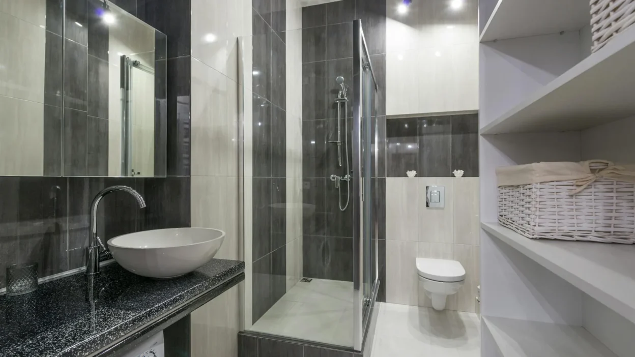 Close-up of soap scum, rust, and hard water stains on a white bathtub surface.