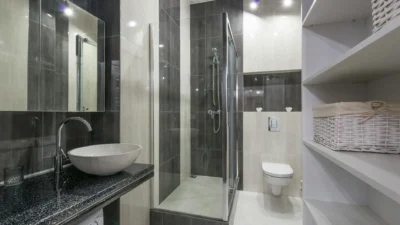 Close-up of soap scum, rust, and hard water stains on a white bathtub surface.